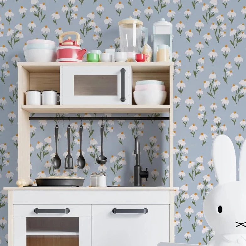 Play kitchen area with Floral Love Wallpaper - Blue, displaying a delightful floral pattern of white flowers on a soft blue background, enhancing the room's charm and coziness