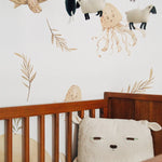 Detailed view of Nursery Animal Wallpaper in a child's room featuring sea creatures and neutral tones