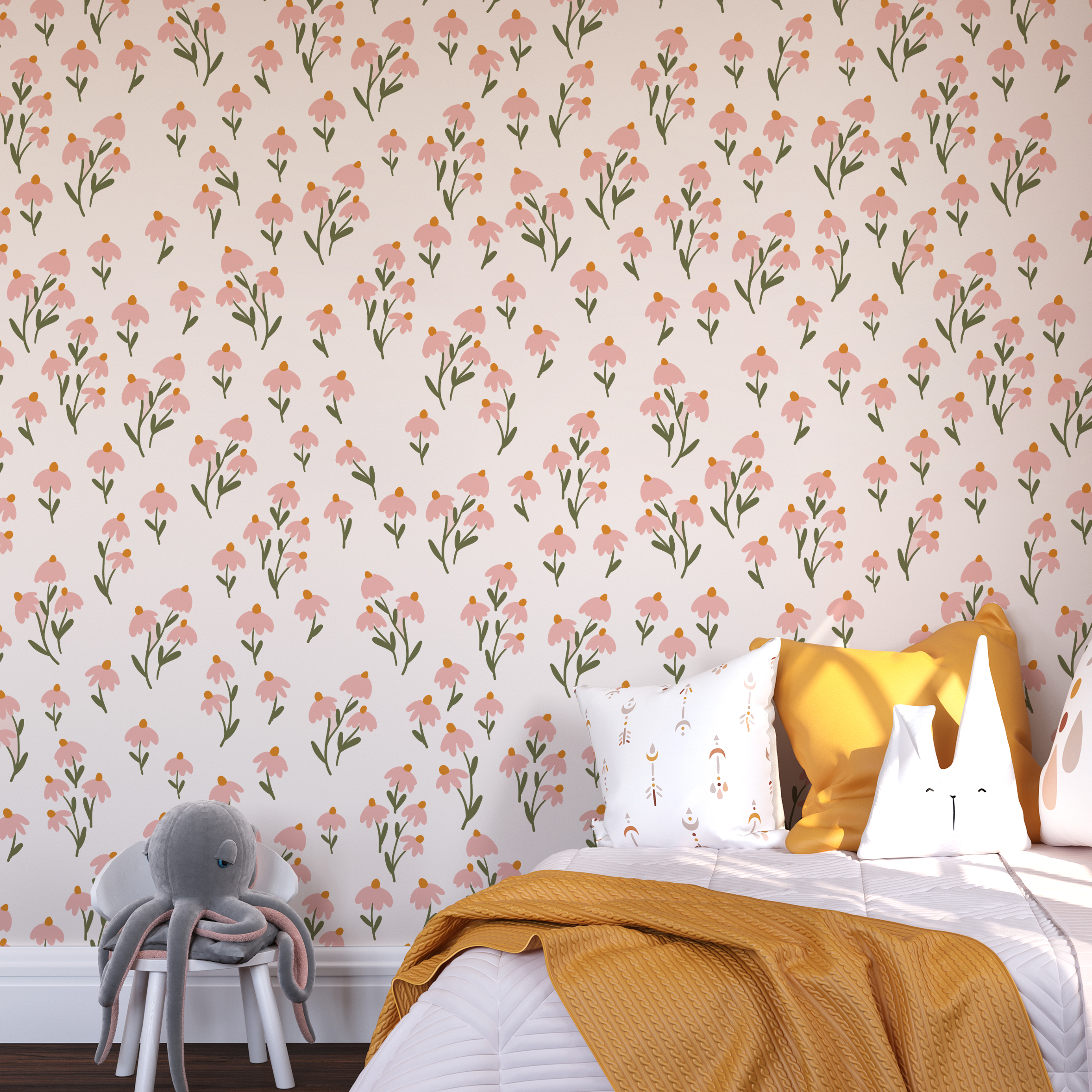 A child's room featuring the Floral Love Wallpaper- Pink on the wall, creating a heartwarming and inviting atmosphere. The wall is adorned with playful pillows, including one with the affectionate phrase "You are so very loved," alongside a cozy yellow blanket and a rattan peacock chair.