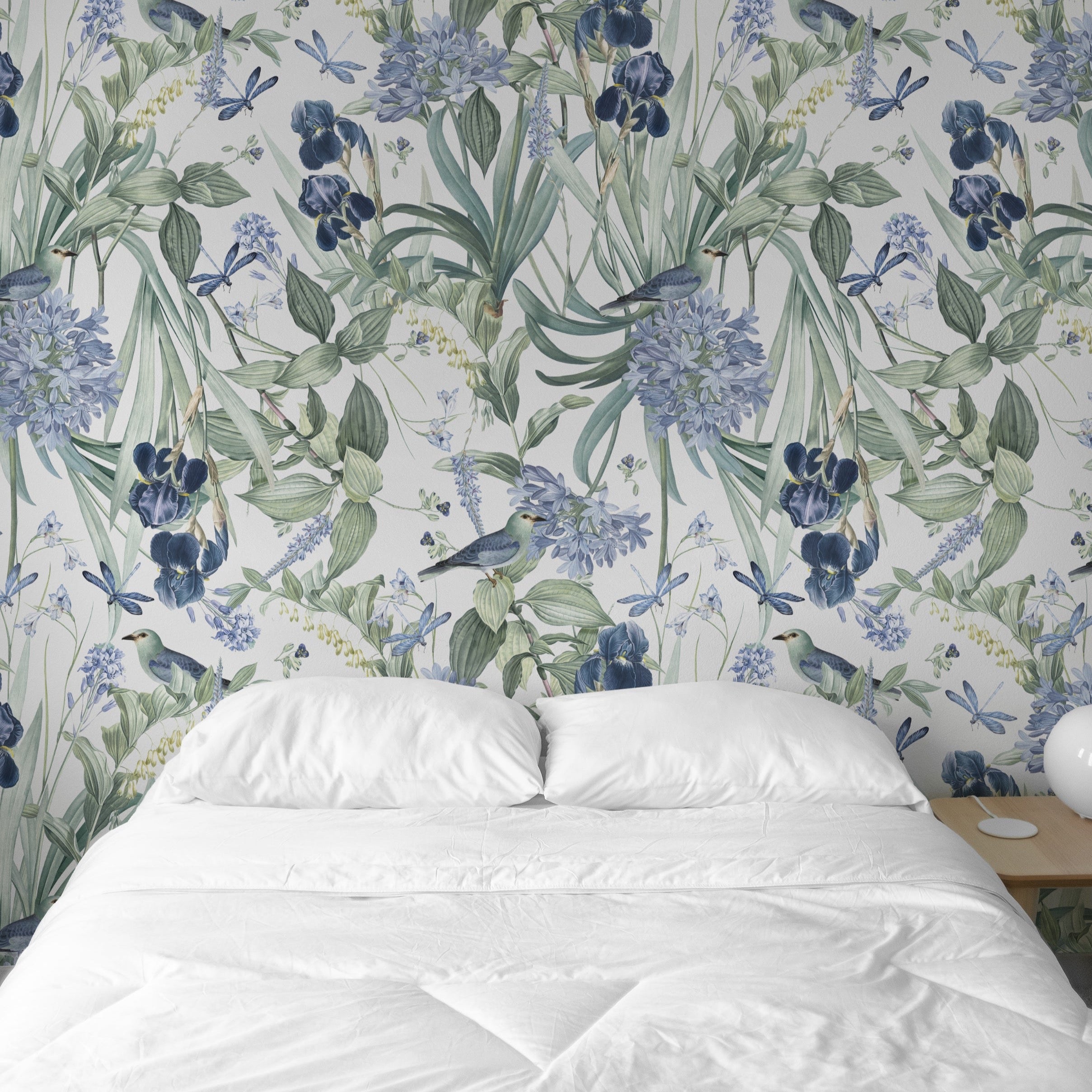A serene bedroom scene with the 'Mint Floral Wallpaper - 50"' serving as an exquisite backdrop to a simple white bed, emphasizing the wallpaper’s ability to add a tranquil and decorative touch to a sleeping area.